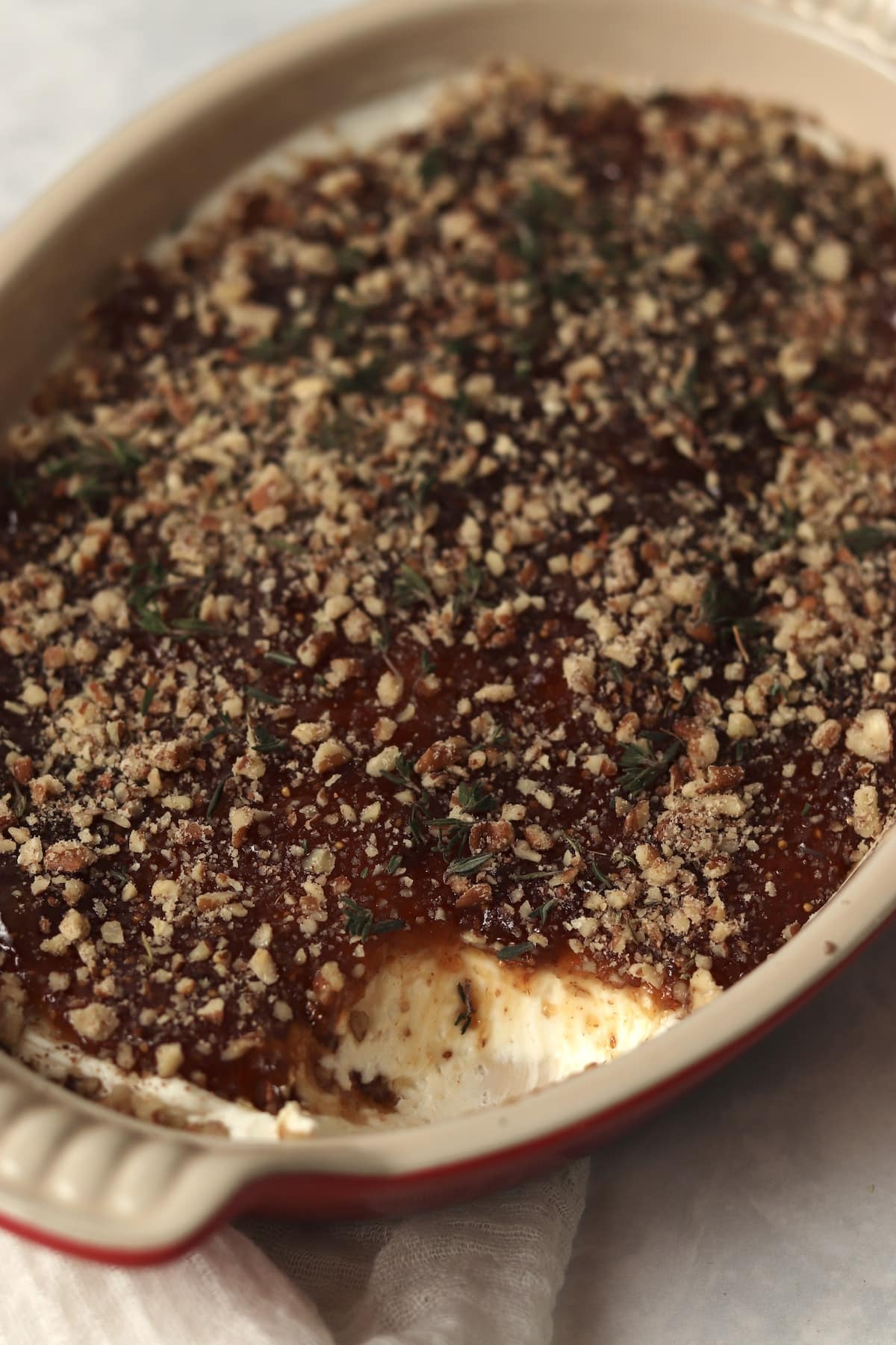 Goat cheese fig dip appetizer in a baking dish.