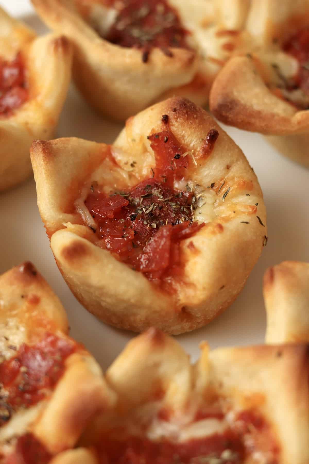 Close up of pepperoni pizza cups.