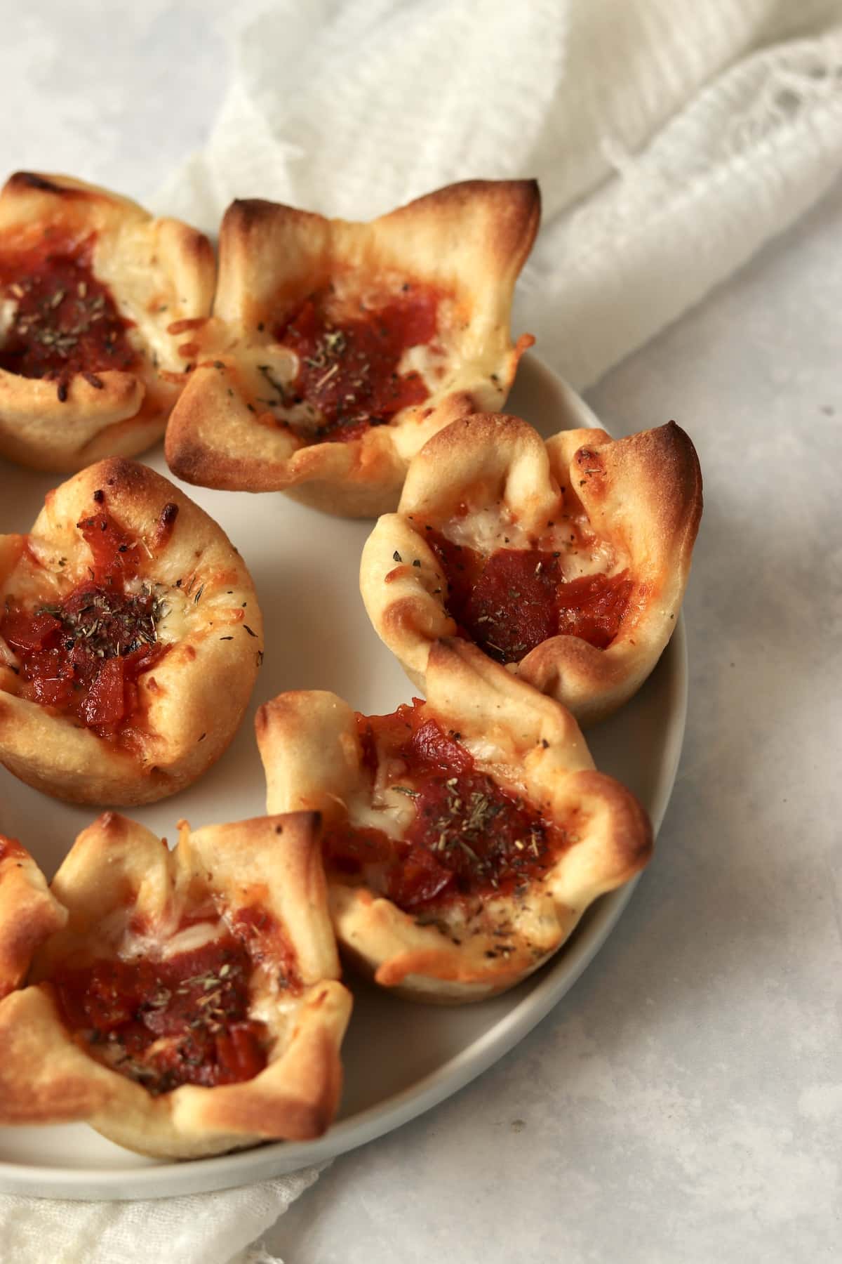 Pepperoni pizza cups on a plate.