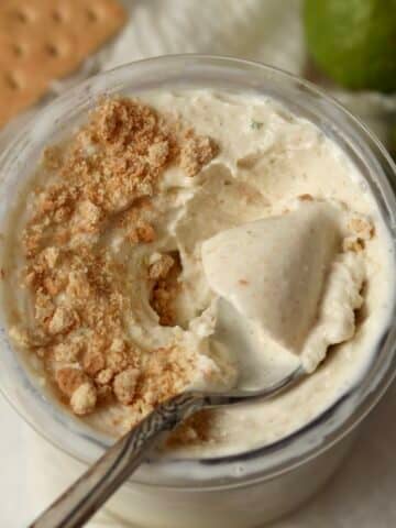 Key lime pie frozen yogurt with graham cracker crumbs in the pint container.