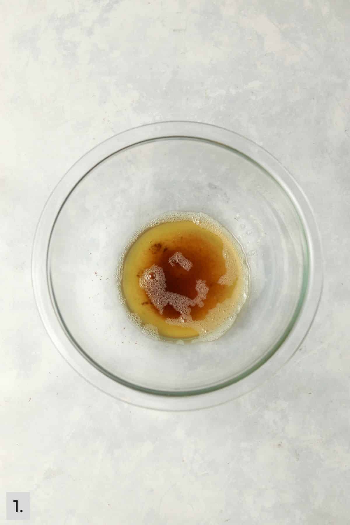 Small amount of brown butter in a glass bowl.