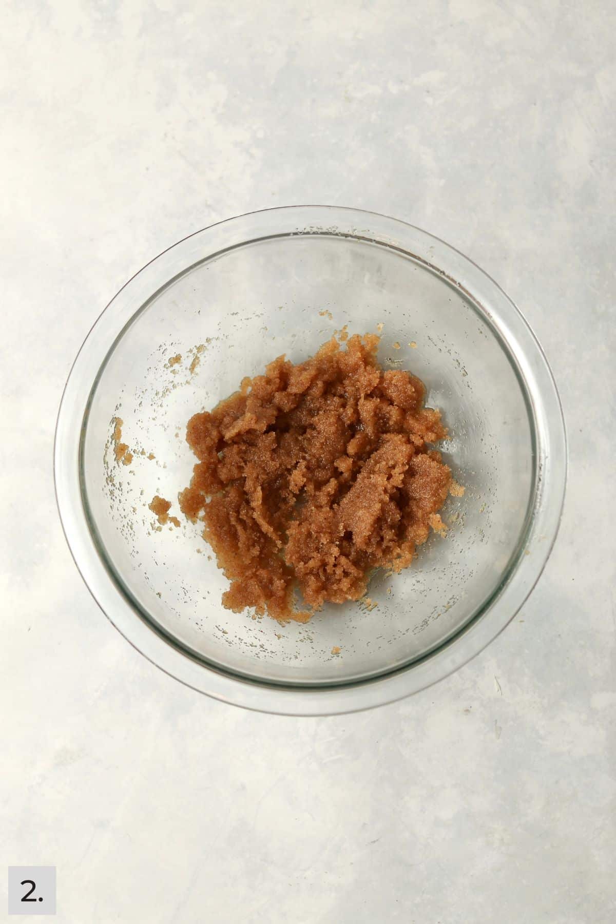 Brown butter mixed with brown sugar and white sugar in a bowl.