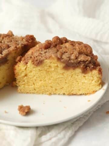 Single serve coffee cake with streusel topping on a small plate.