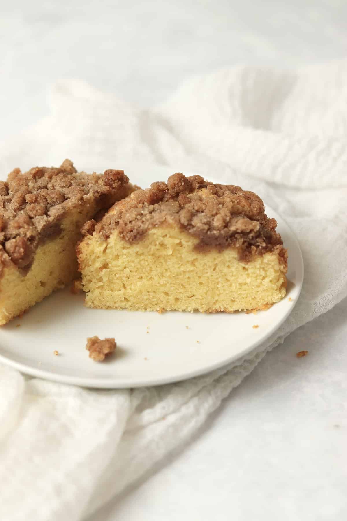 Single serve coffee cake with streusel topping on a small plate.