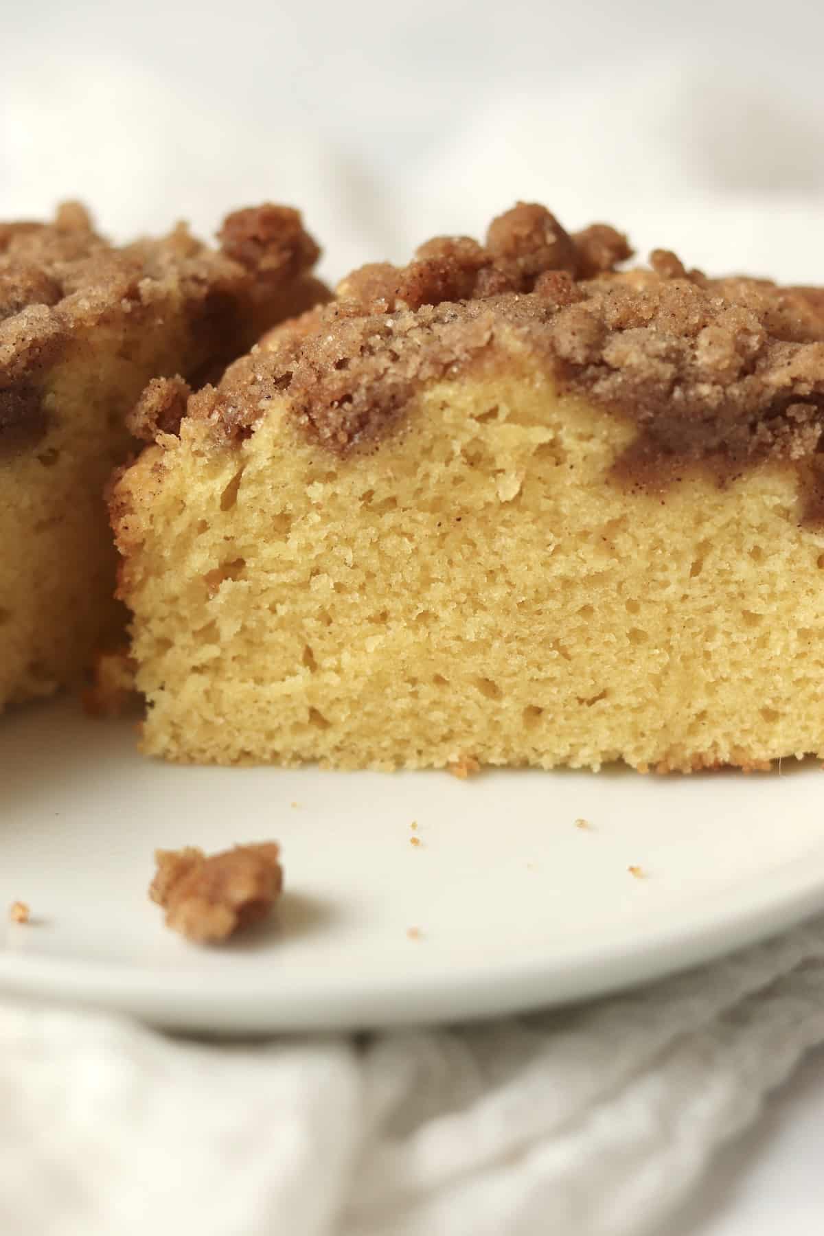 Close up of single serve streusel coffee cake cut in half.