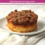 Single serve coffee cake with streusel topping on a plate.