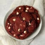 Single serve red velvet cookie on a plate.