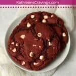 Single serve red velvet cookies on a plate.