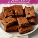 Plate of almond butter chocolate chip cookie bars cut into squares.