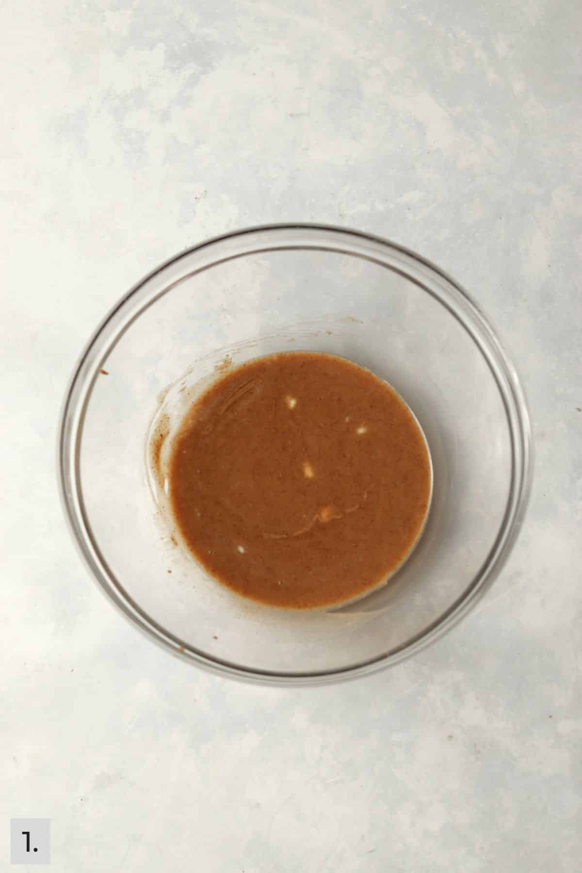 Almond butter melted with butter in a mixing bowl.