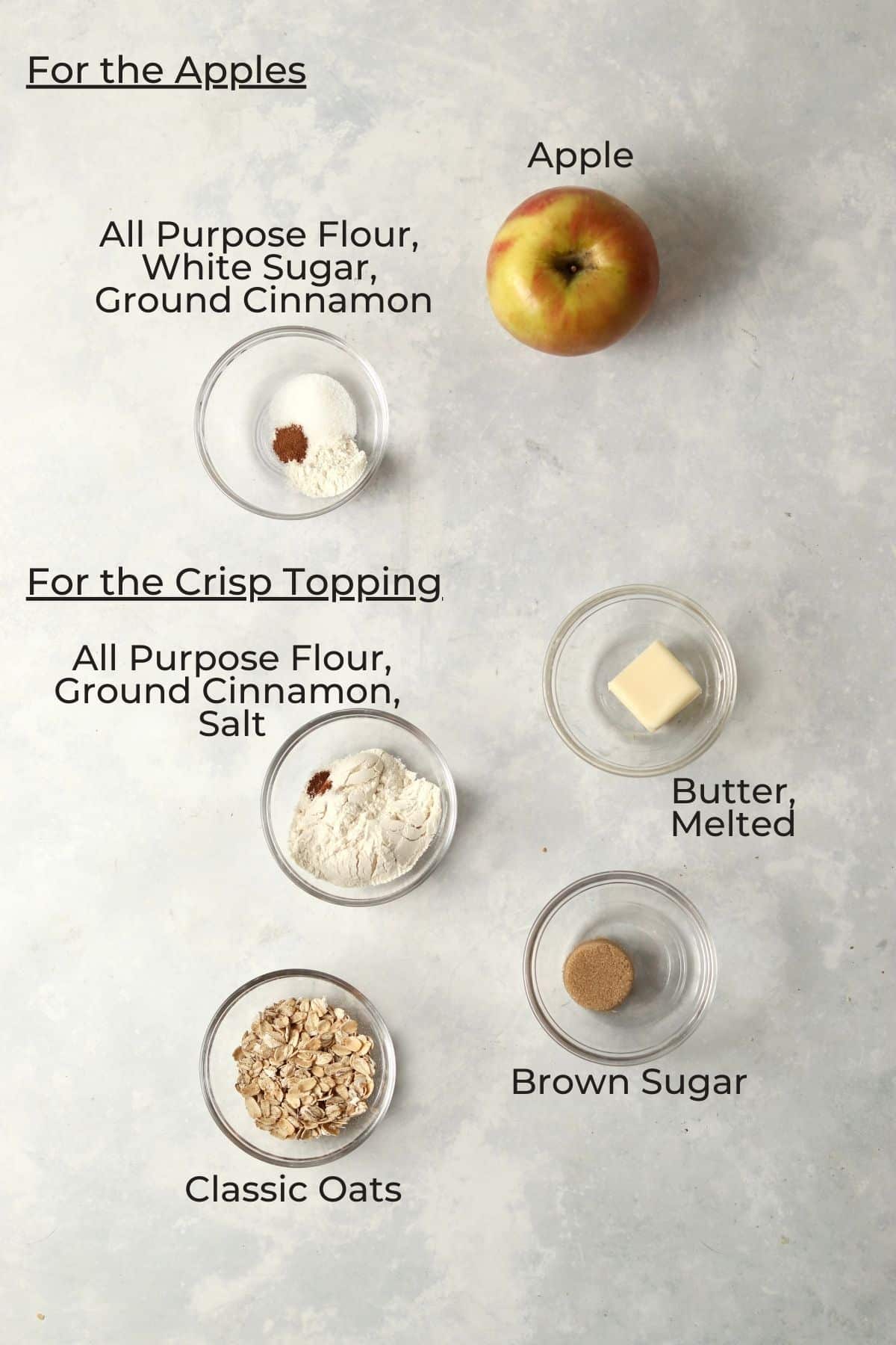 Ingredients for an individual apple crisp in small glass prep bowls.