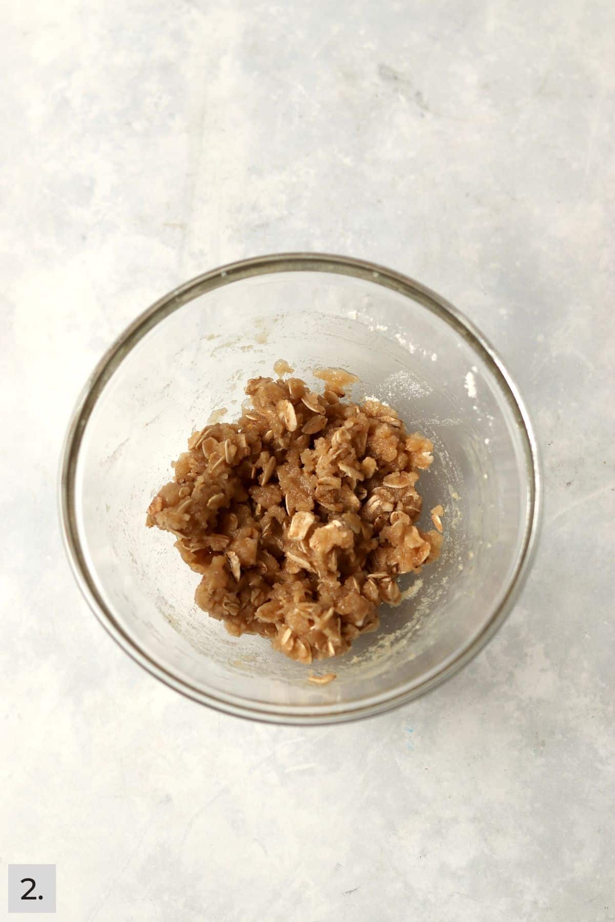 A small batch of crisp topping made with oats in a bowl.