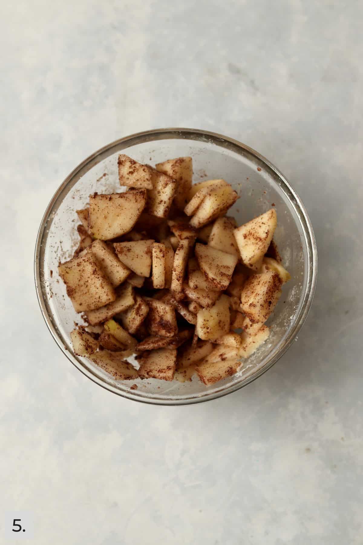 Sliced apples tossed with cinnamon, sugar, flour, and lemon juice.
