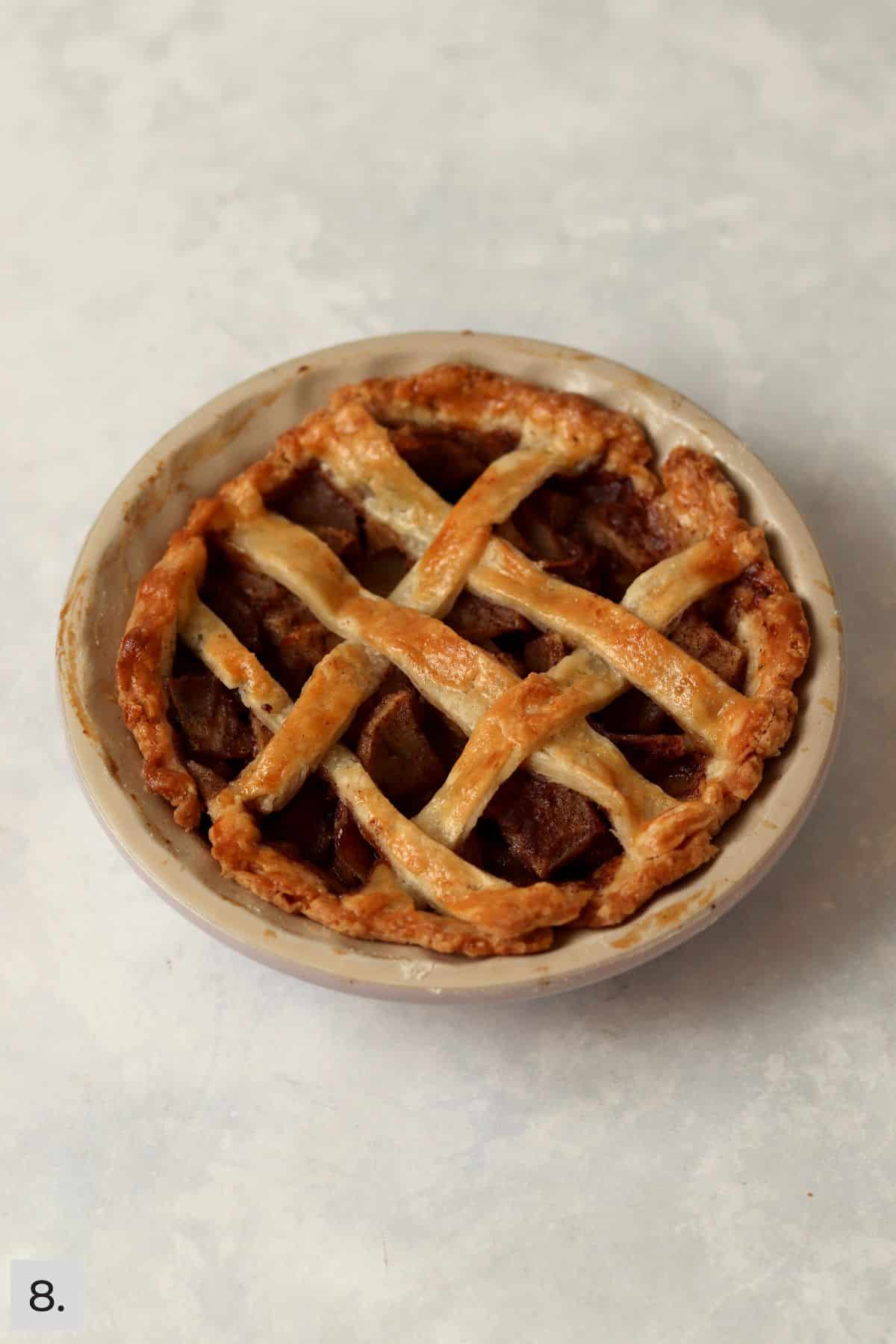 Baked small single serve pecan pie in the pie dish.