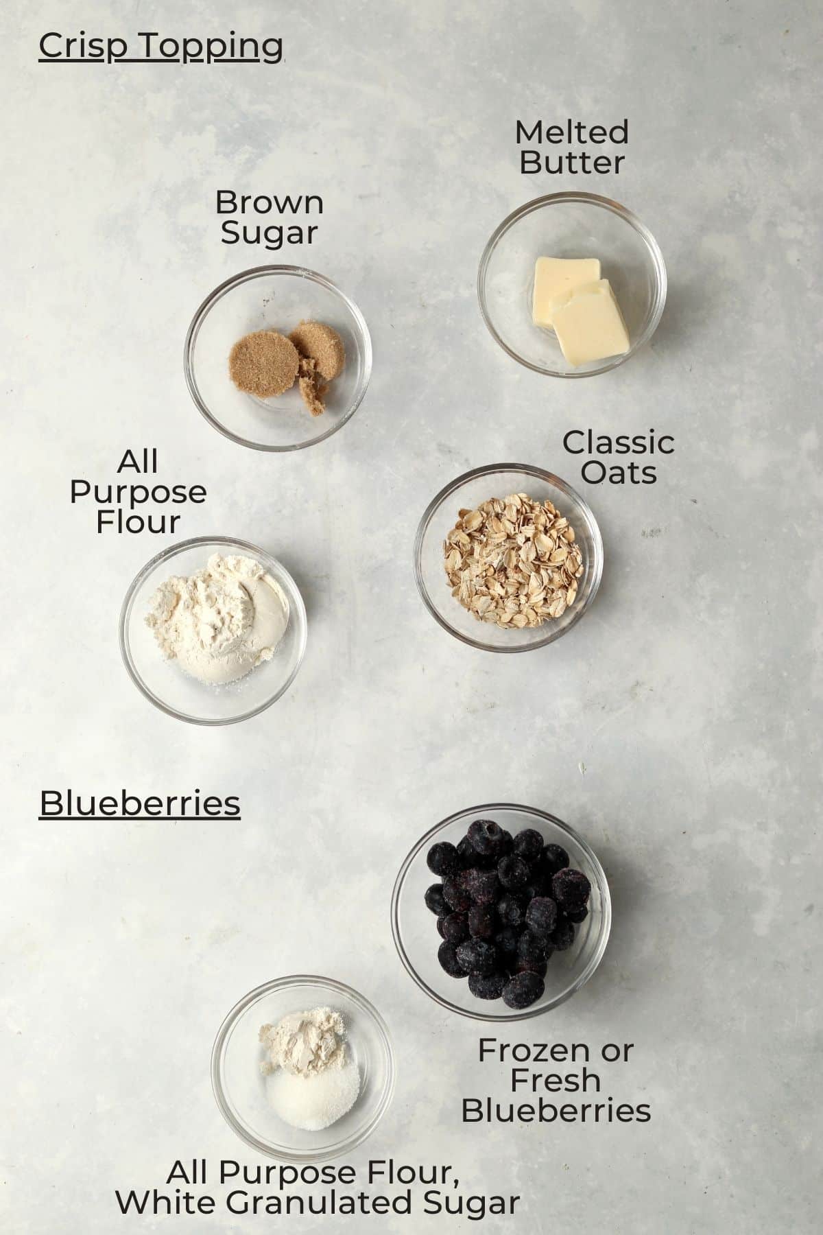 Blueberry crisp ingredients in small prep bowls.