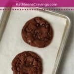 Single serve double chocolate cookies baked on a cookie sheet.