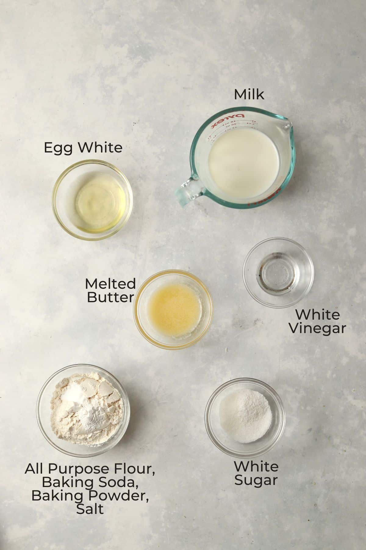 Ingredients to make small batch pancakes in glass prep bowls.