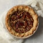 Single serve pecan pie in a mini 5 inch pie dish after baking.