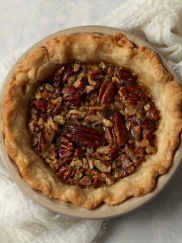 Single serve pecan pie in a mini 5 inch pie dish after baking.