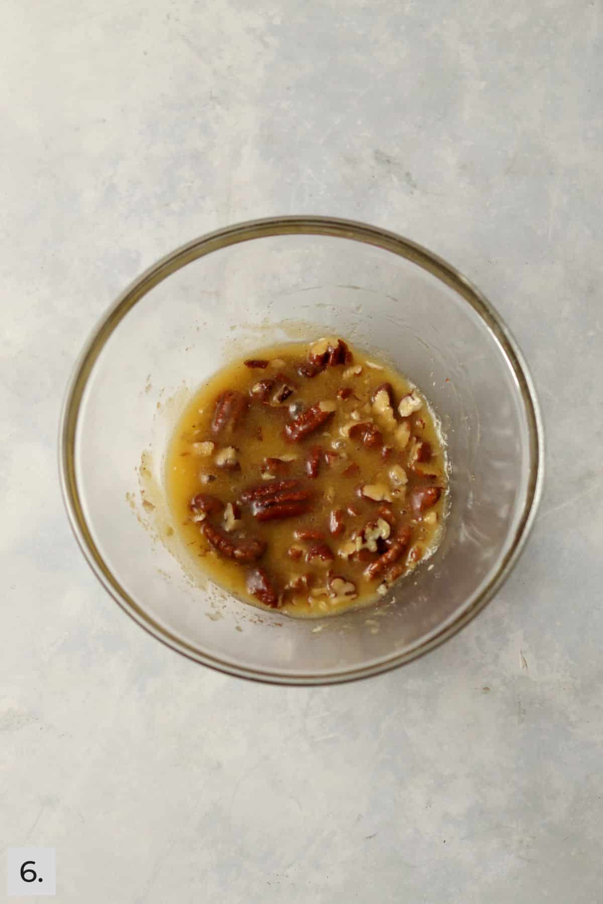 Small batch of pecan pie filling in a glass bowl.