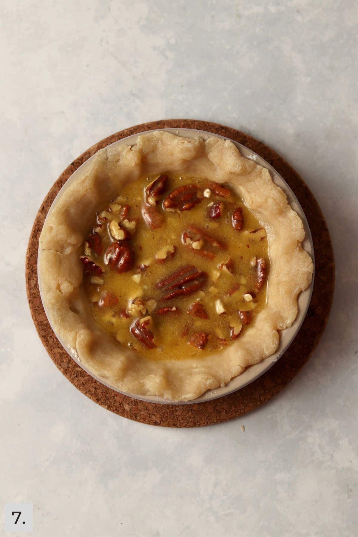 Unbaked small pecan pie in the 5 inch pie dish.