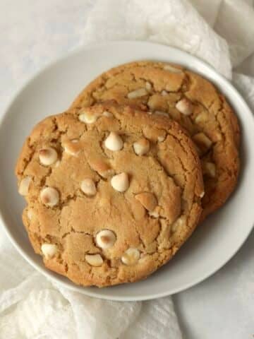 Single serve white chocolate macadamia nut cookie on a plate.