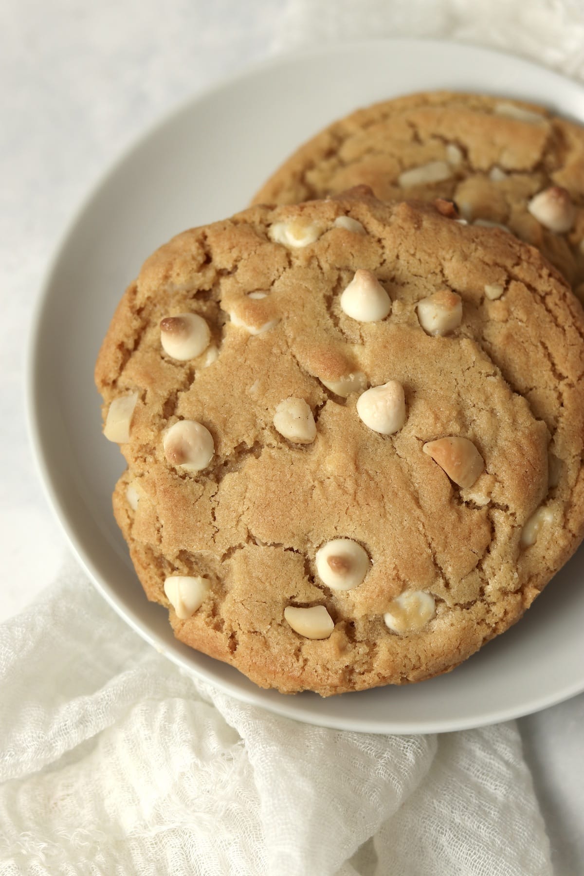 Single serve white chocolate macadamia nut cookie on a plate.
