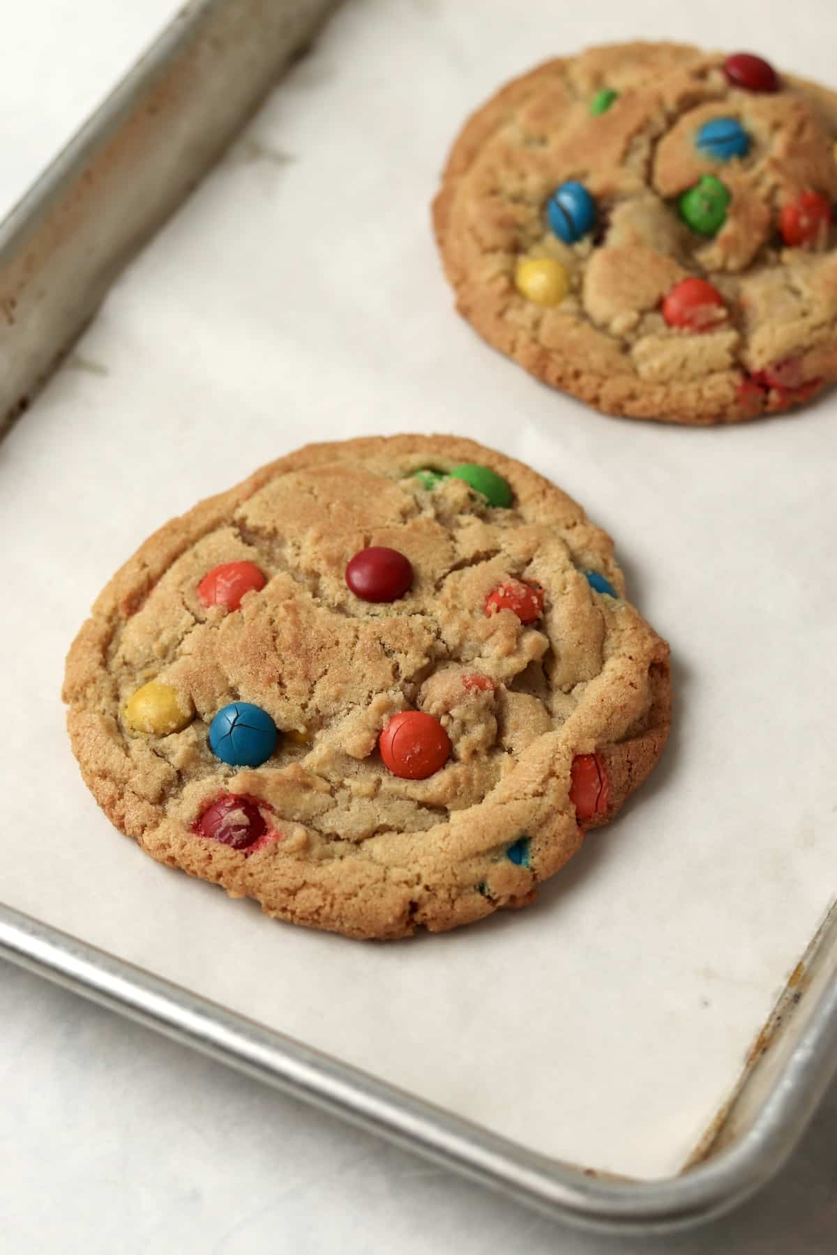 Small batch M&M cookies on a baking sheet.