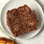 Single Serve Cinnamon Swirl Banana Bread cut in half to show center with a ripe banana.