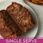 Single Serve Cinnamon Swirl Banana Bread cut in half to show center with a ripe banana.