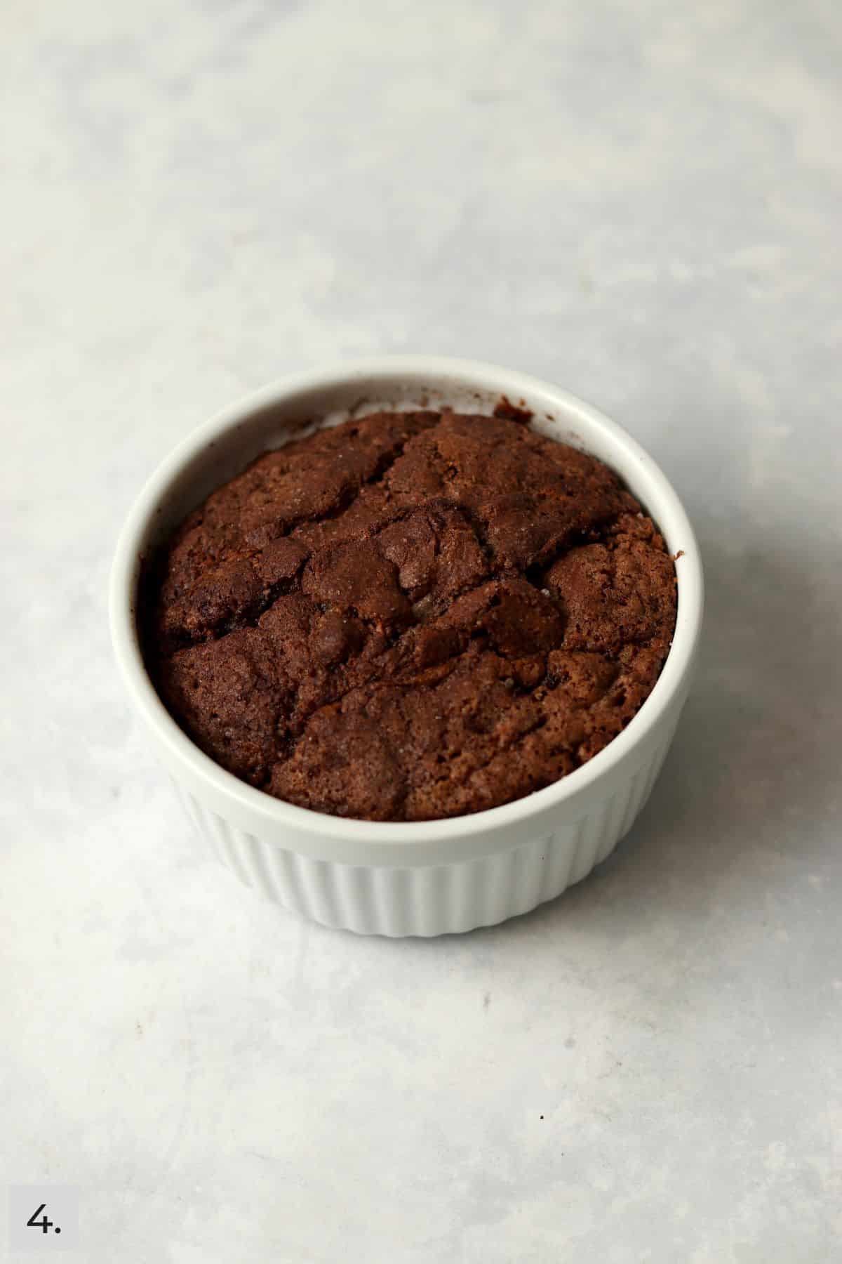 Baked single serve cinnamon swirl banana bread in a ramekin.