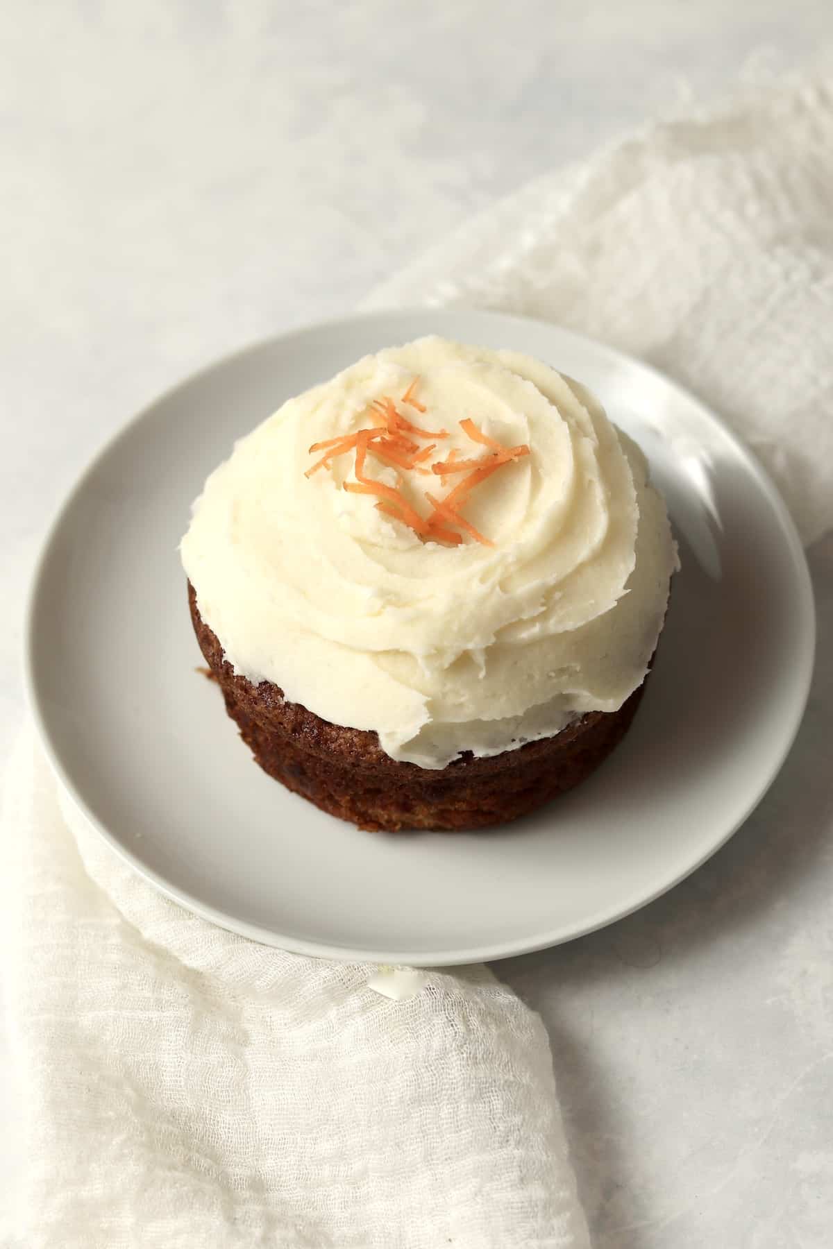 Single serve carrot cake with cream cheese frosting.