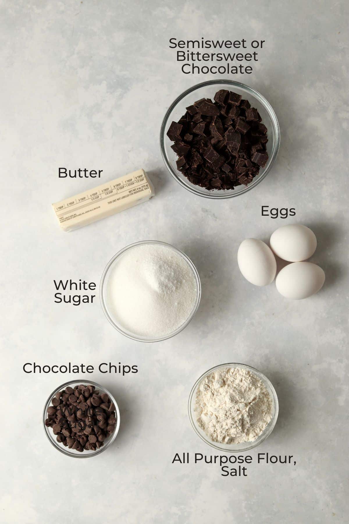 Ingredients for fudgy brownies in glass prep bowls.