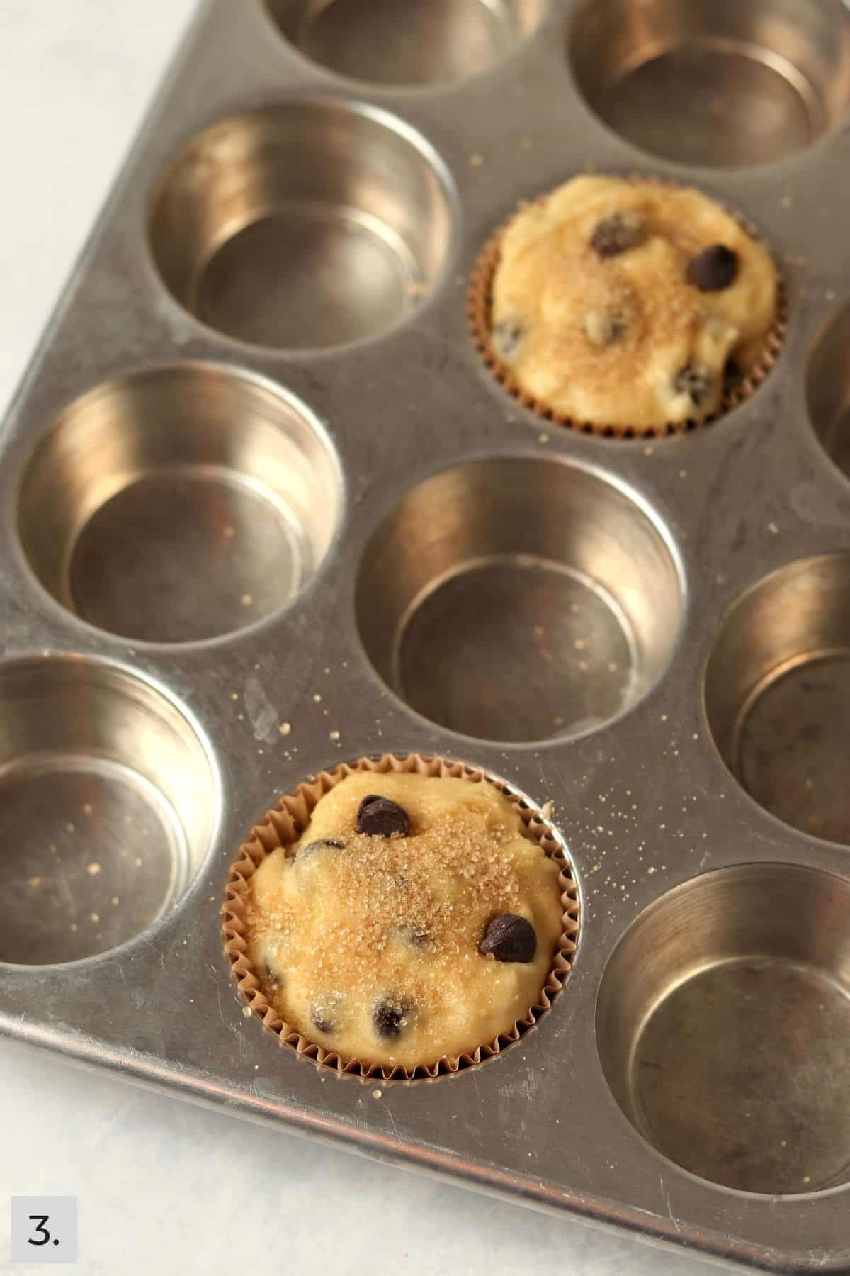 Unbaked single serve chocolate chip muffins in the pan.