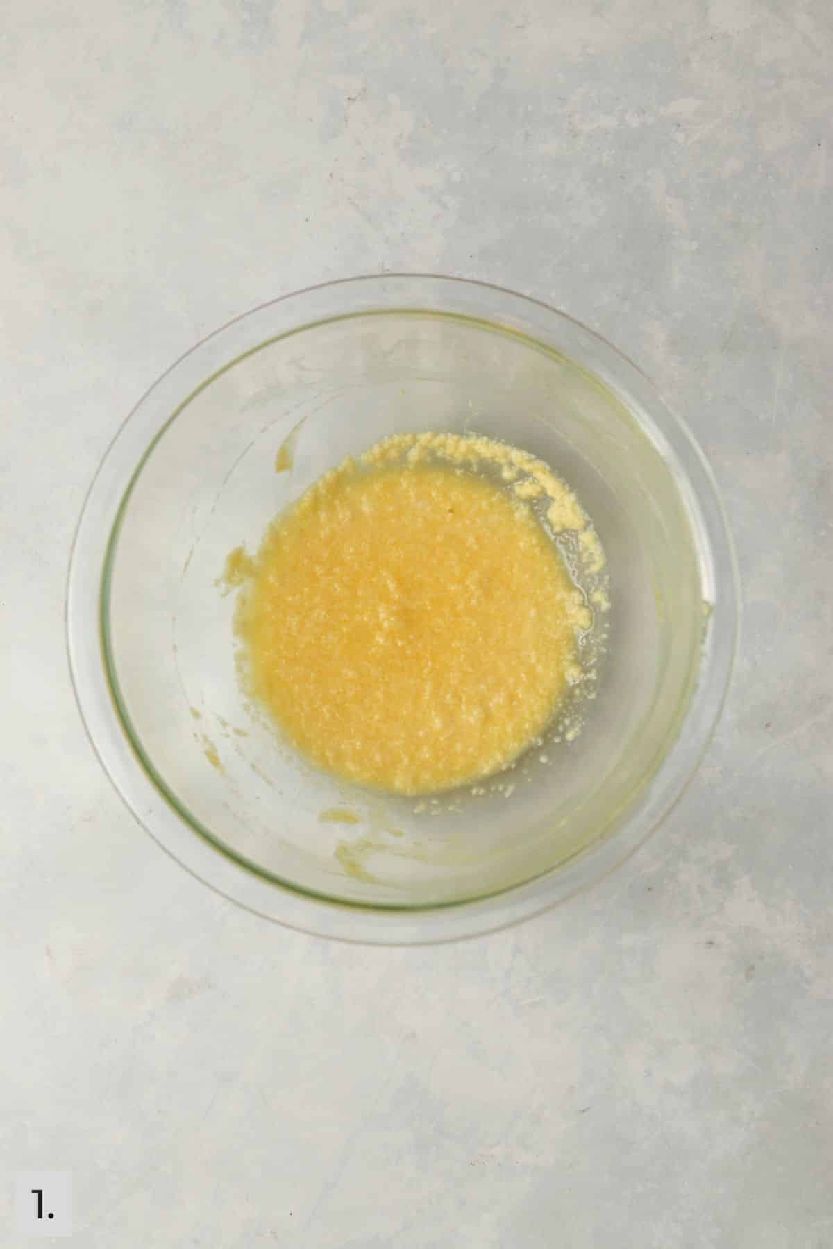 Wet ingredients for cinnamon cake in a mixing bowl.