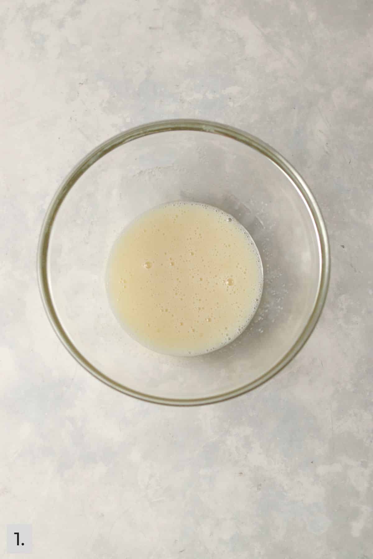 Wet ingredients for confetti cake batter in a bowl.