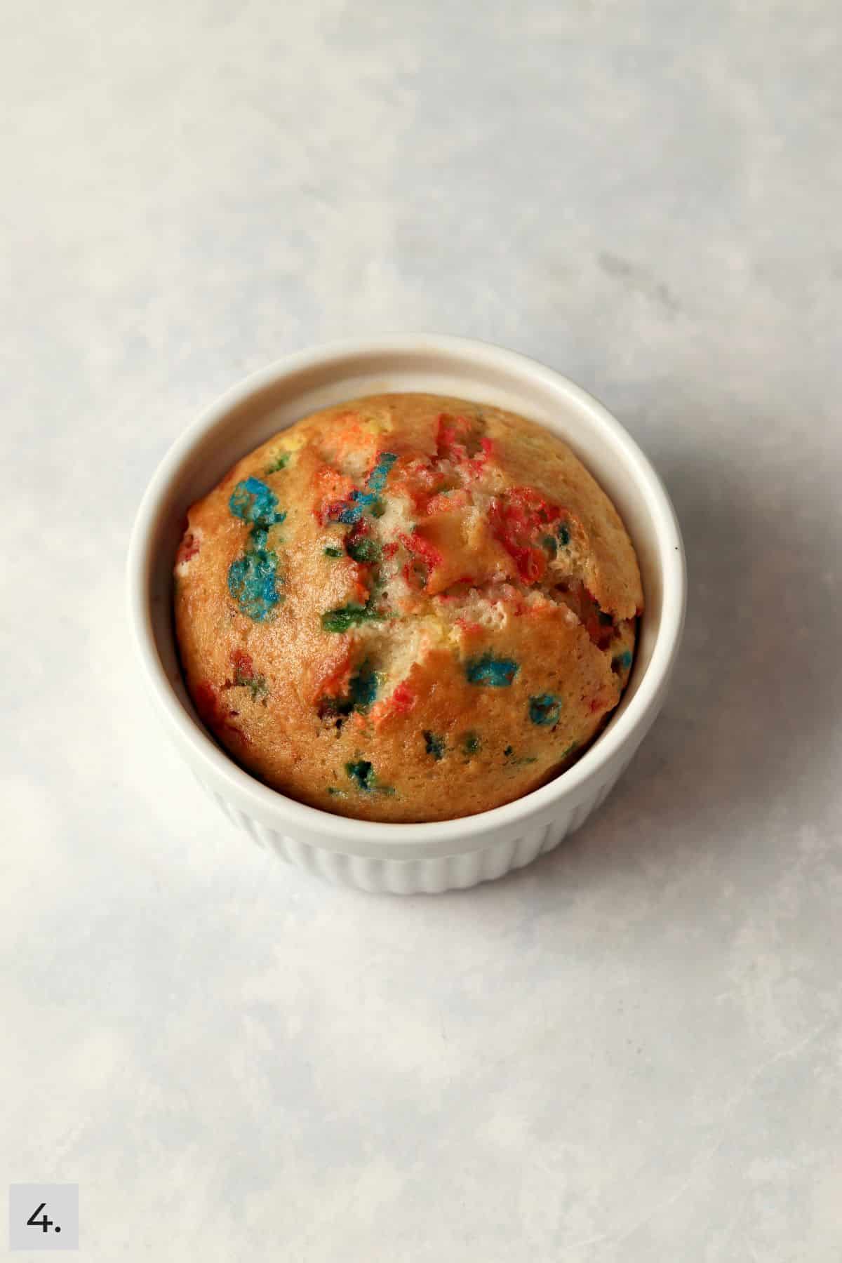 Baked single serve confetti cake in a ramekin.