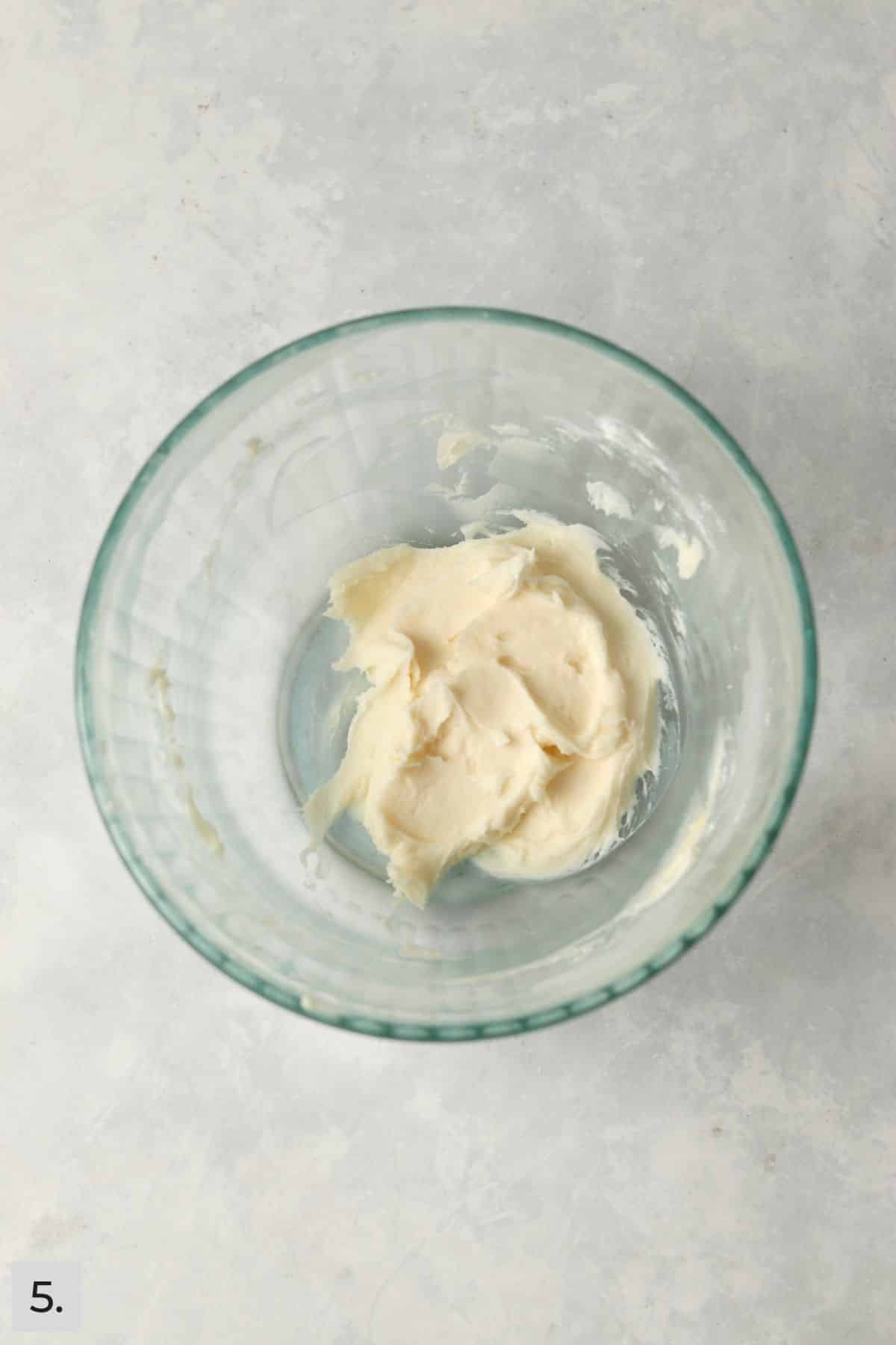 Small batch of frosting in a bowl.