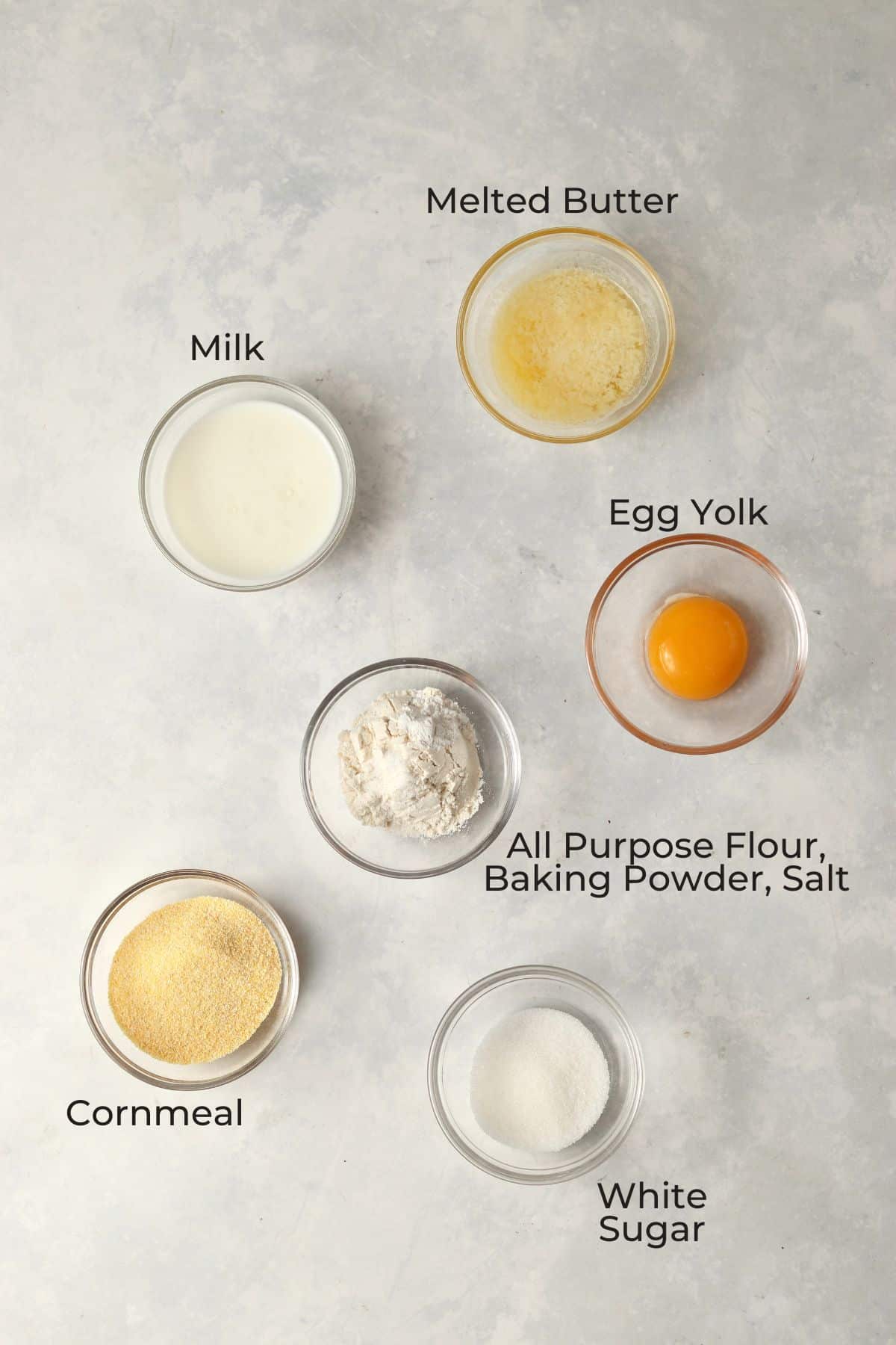 Small batch cornbread ingredients in small glass prep bowls.