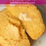 Single serve cornbread cut in half and slathered in butter.