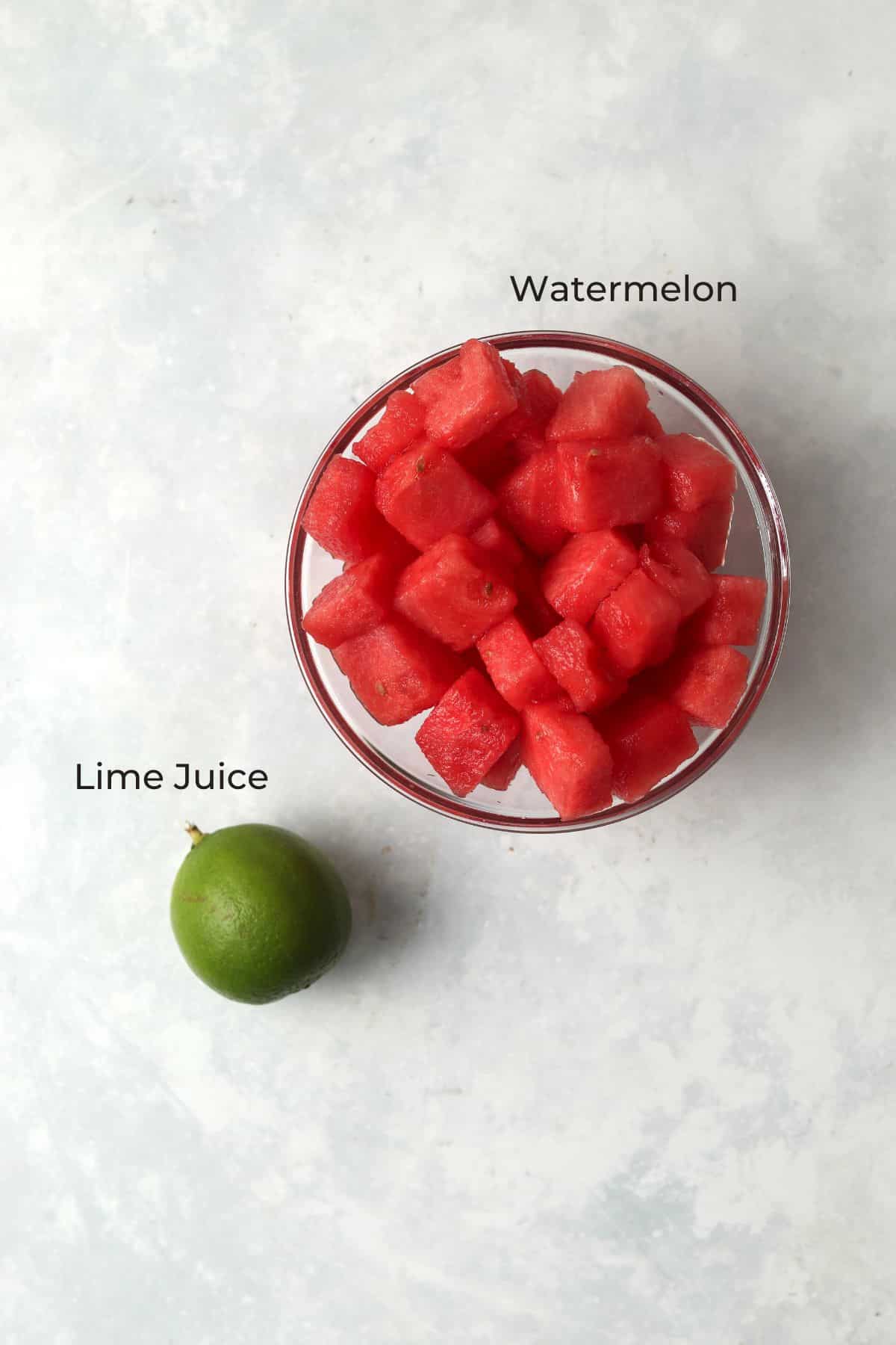Cubed watermelon and a lime.