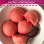 Watermelon sorbet scooped in a bowl with lime.