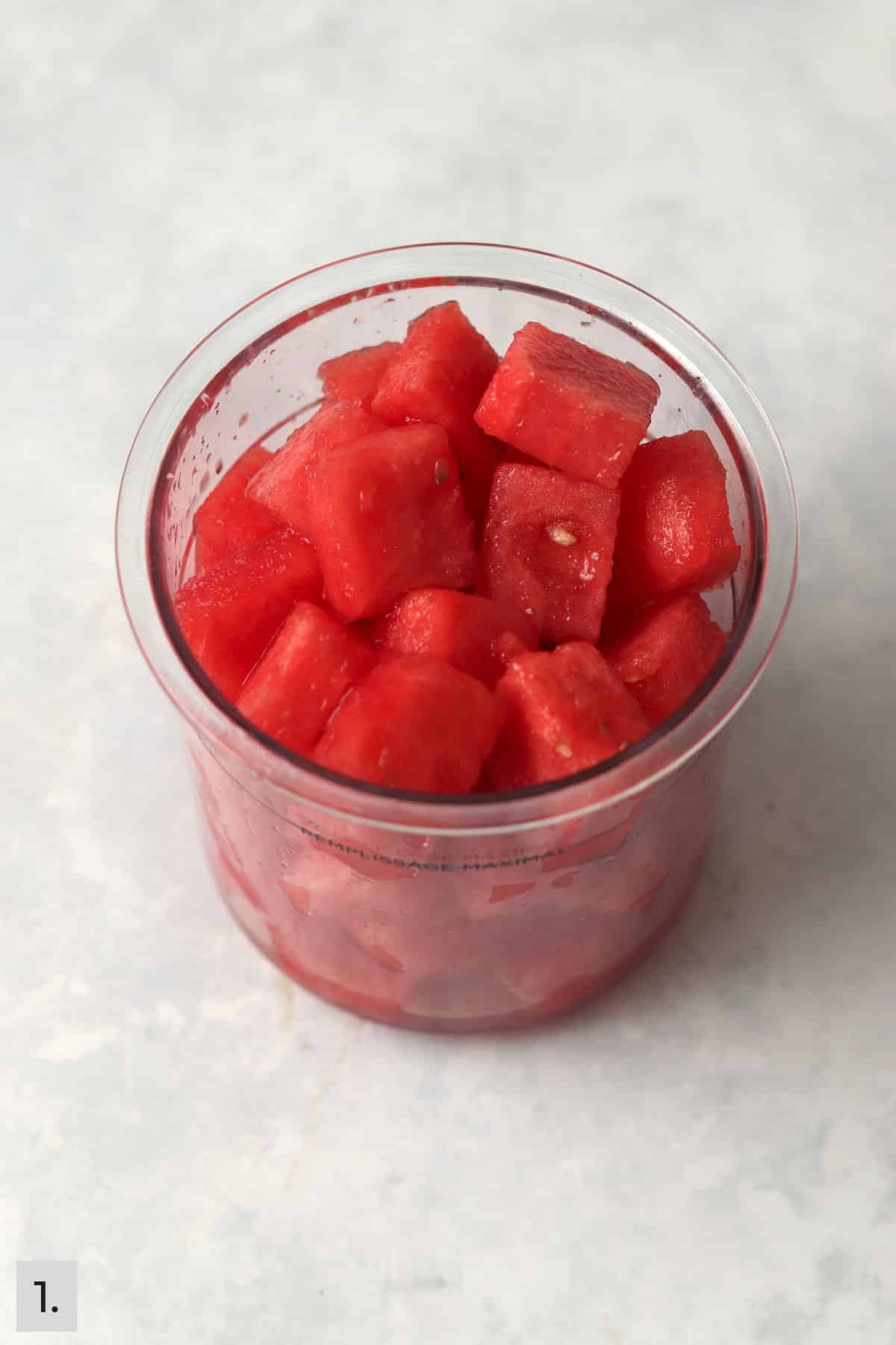 Fresh watermelon in a Ninja Creami pint container.