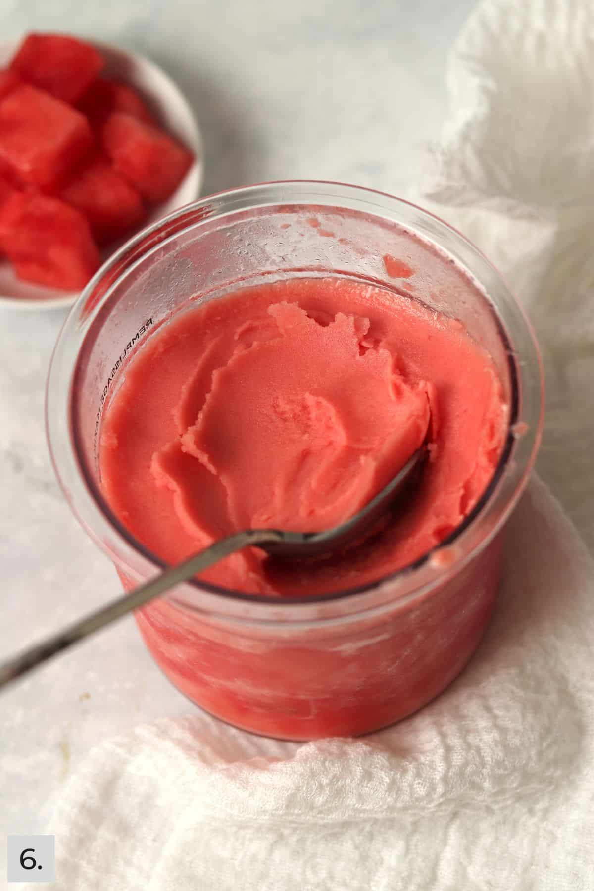 Creamy watermelon sorbet in pint container.