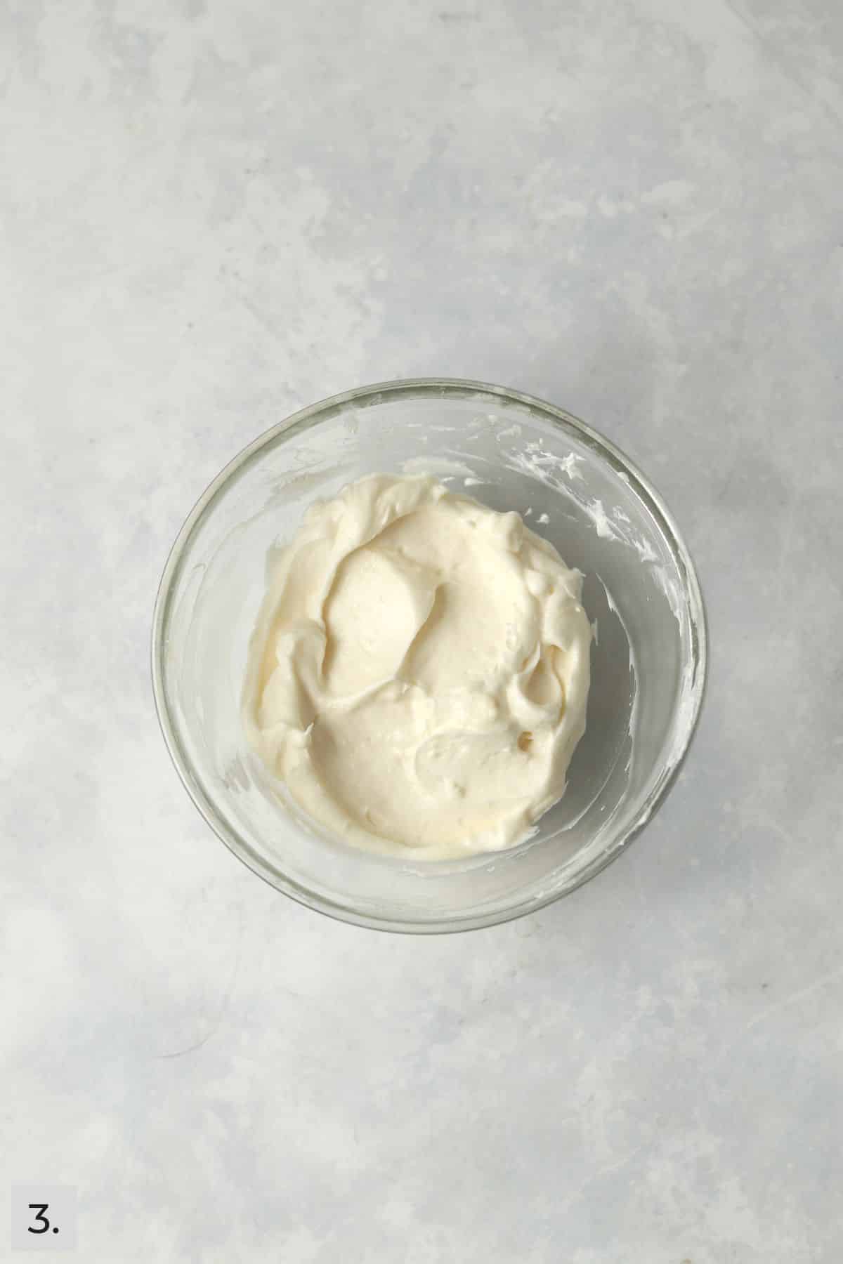 A small batch of fruit dip mixed together in a glass bowl.