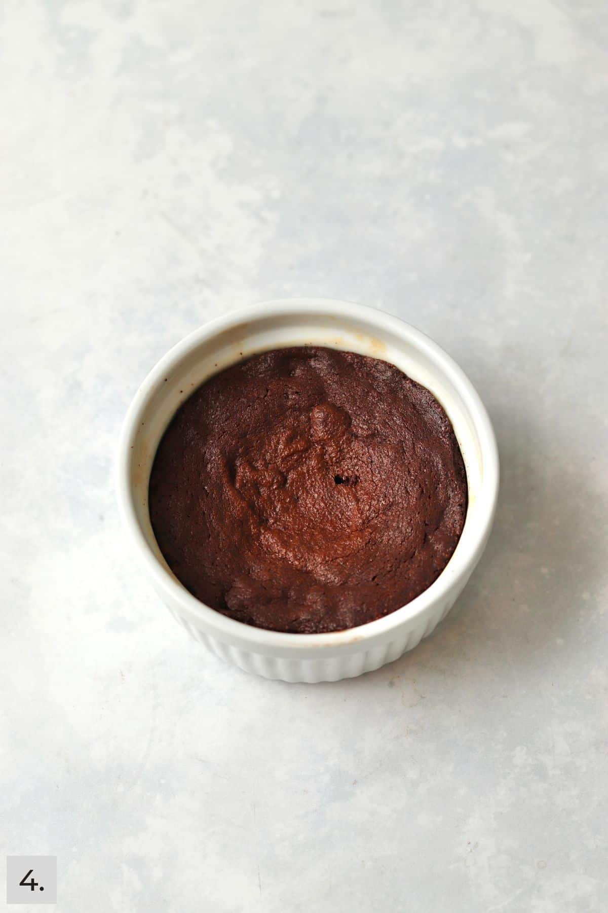 Baked single serve brownie in a ramekin.