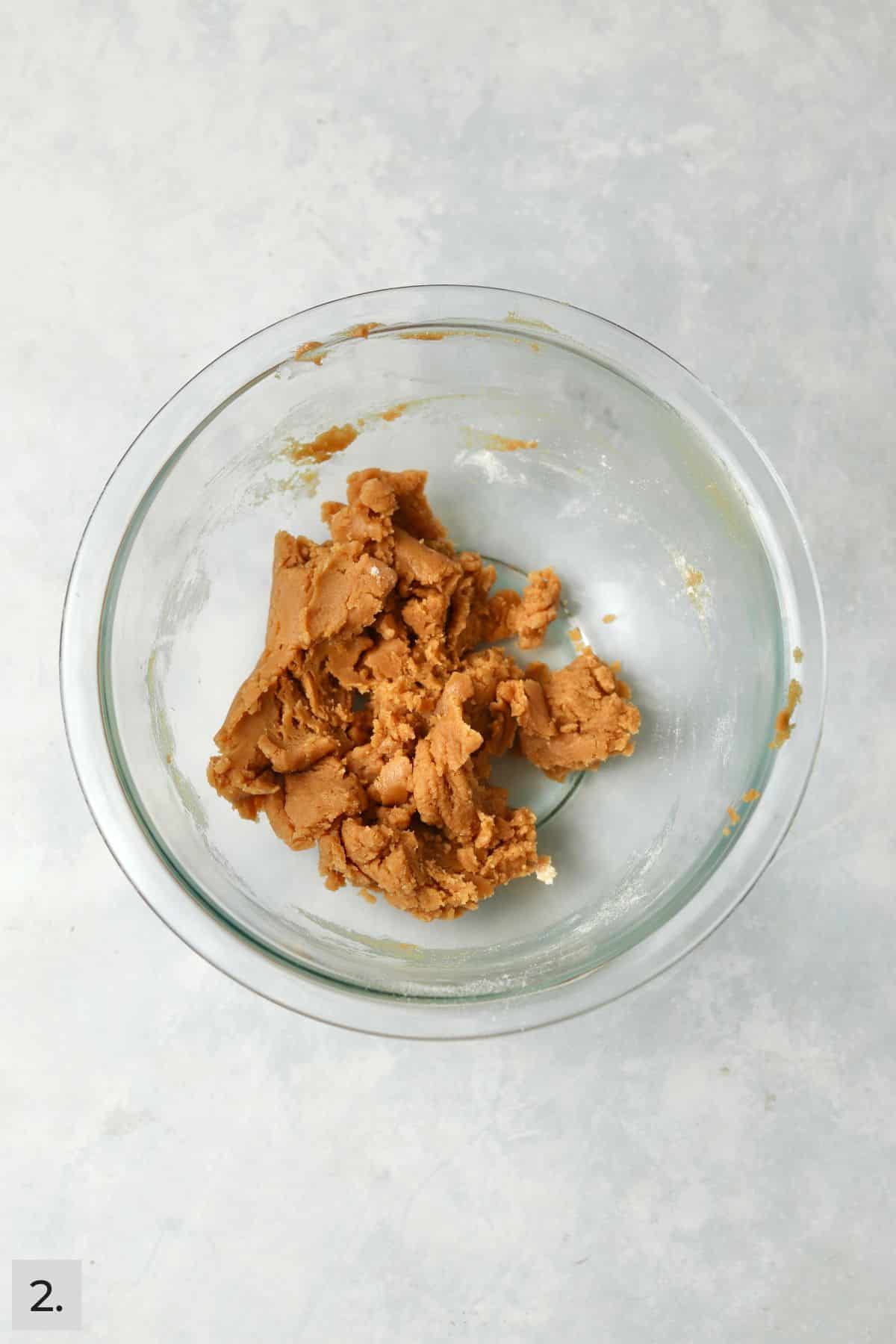Small batch of peanut butter cookie dough in a bowl.