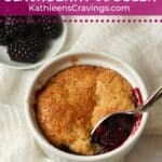 A mini blackberry cobbler in a ramekin.