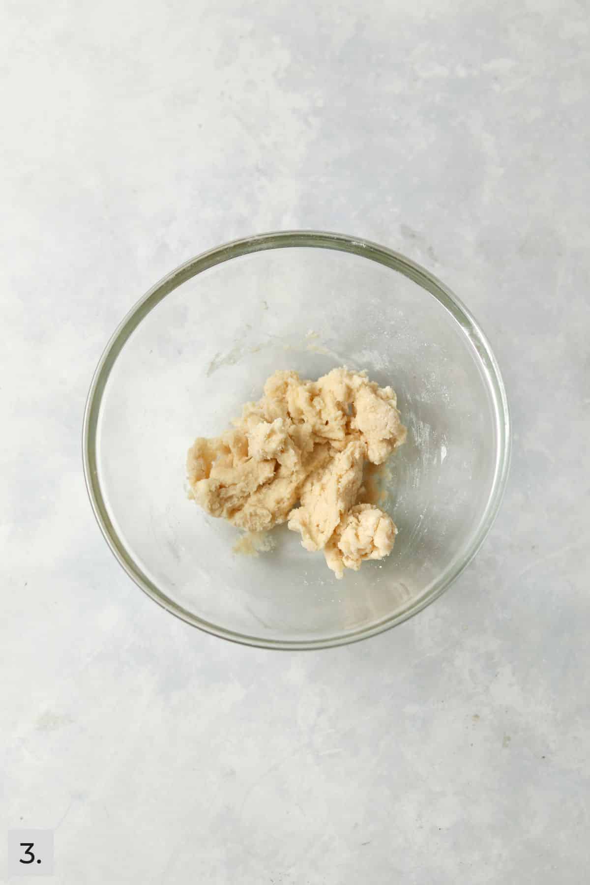 Biscuit cobbler topping in a small bowl.