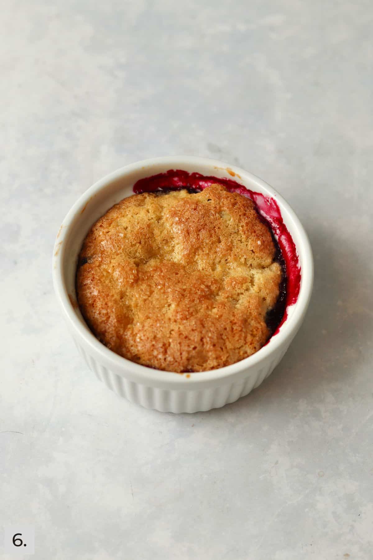 Baked single serve blackberry cobbler in a ramekin.